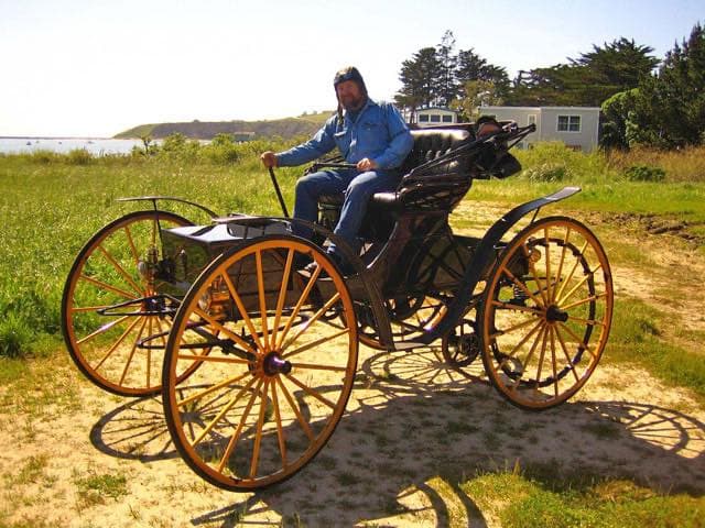 Classic hot rod with custom paint job showcased at Pacific Coast Dream Machines event in Half Moon Bay, California.
