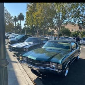 Vintage muscle car showcased at Pacific Coast Dream Machines event in Half Moon Bay, California.