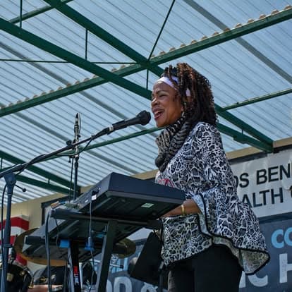 Vintage keyboard and microphone on stage at Pacific Coast Dream Machines event in Half Moon Bay, California.