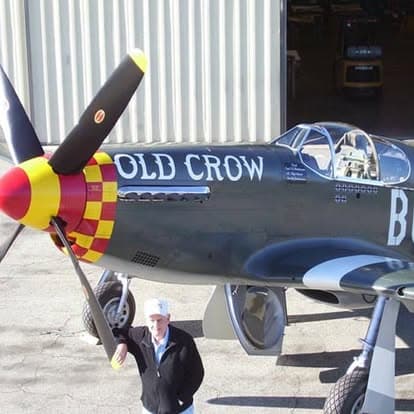 Vintage military aircraft with propellers on display at Pacific Coast Dream Machines in Half Moon Bay, California.