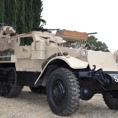 Vintage military truck with armored design at Pacific Coast Dream Machines event, Half Moon Bay, California.