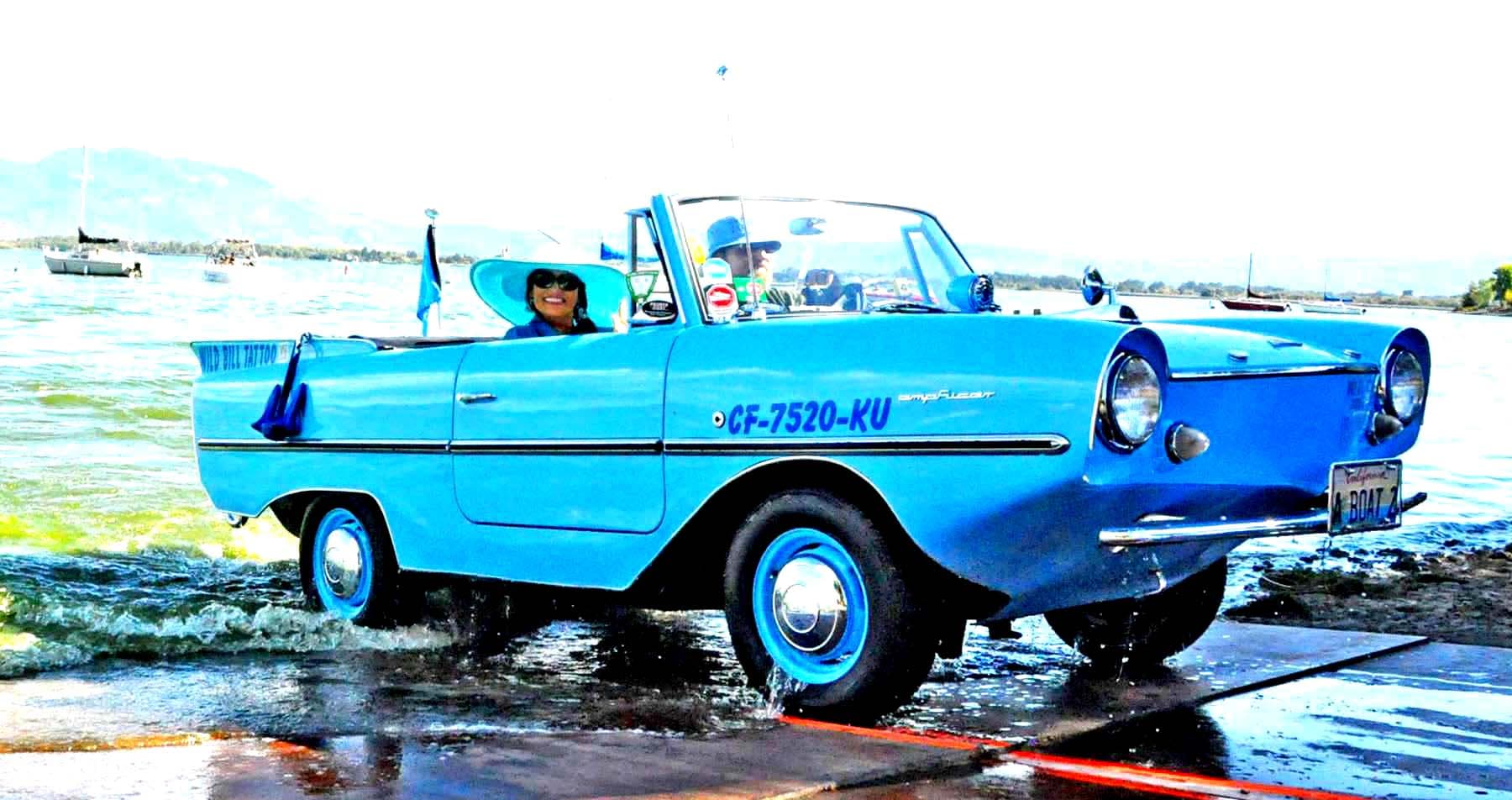 Roxanne and Wild Bill's 1964 Amphicar #137 at a boat ramp entering the water